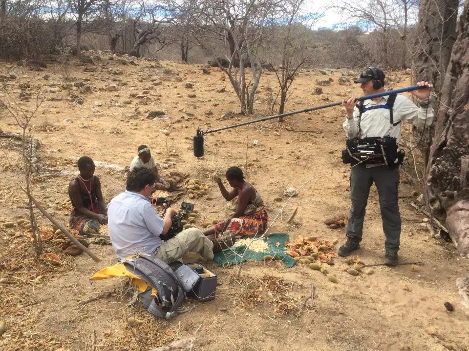 Sebastian recording members of the Hadza community in Tanzania